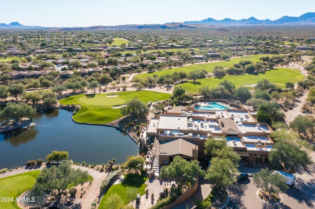 birds eye view of property with a water and mountain view