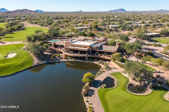 drone / aerial view featuring a water and mountain view