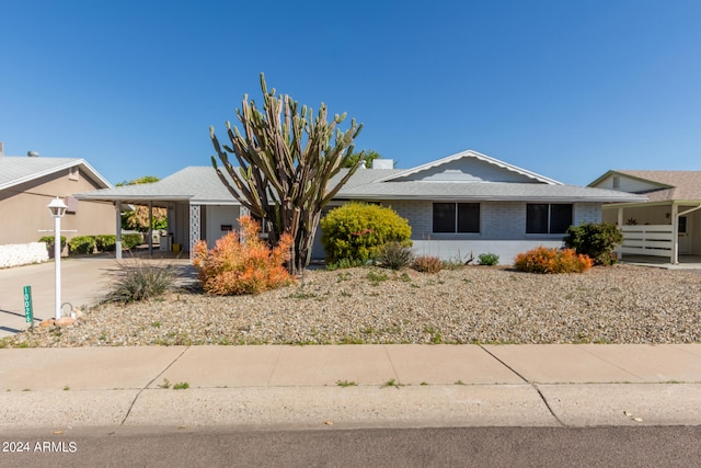 single story home with a carport