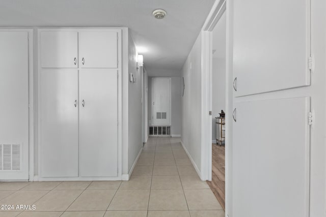 hallway with light tile flooring