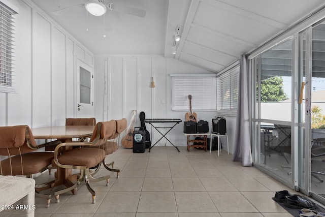 interior space featuring ceiling fan, lofted ceiling, and track lighting