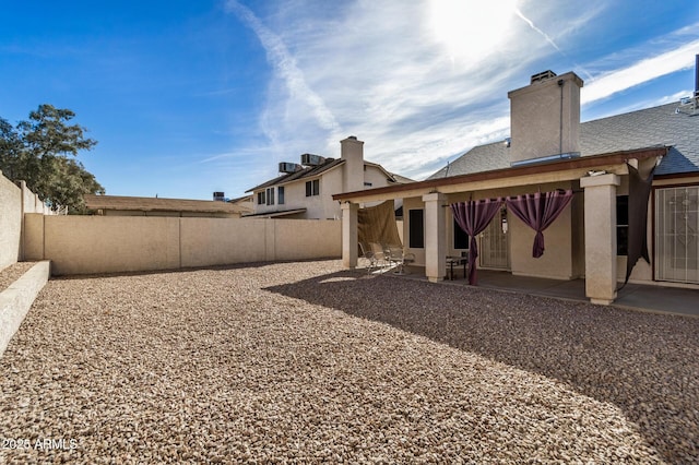 view of yard featuring a patio area and a fenced backyard