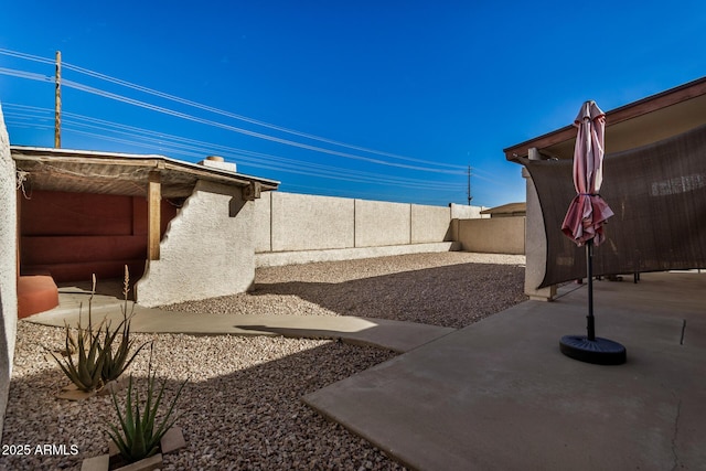 view of yard featuring a fenced backyard and a patio