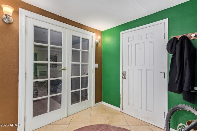 entrance foyer with french doors and light tile patterned flooring