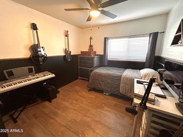 bedroom featuring ceiling fan and hardwood / wood-style flooring