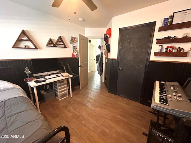 bedroom featuring ceiling fan and hardwood / wood-style flooring