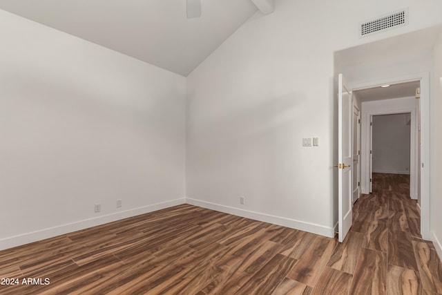 unfurnished room featuring lofted ceiling with beams, dark wood-type flooring, and ceiling fan