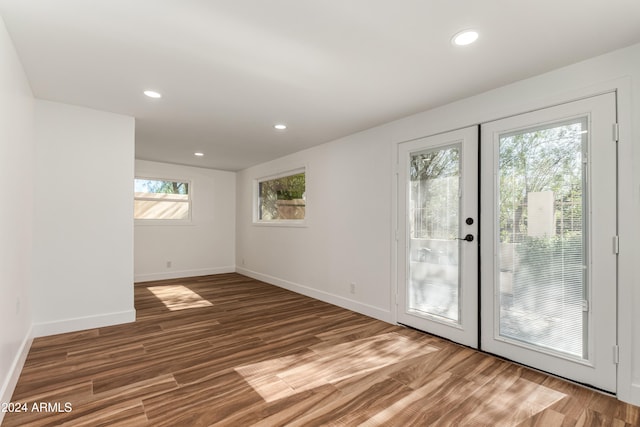 doorway to outside with french doors and dark wood-type flooring