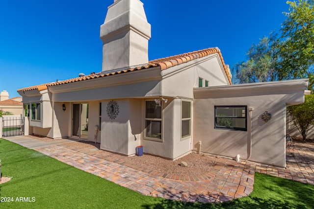 rear view of house with a patio