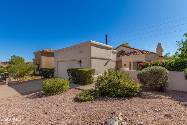 view of front of property with a garage