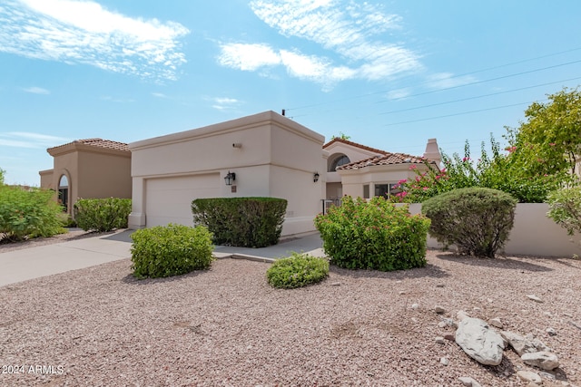 mediterranean / spanish-style house featuring a garage