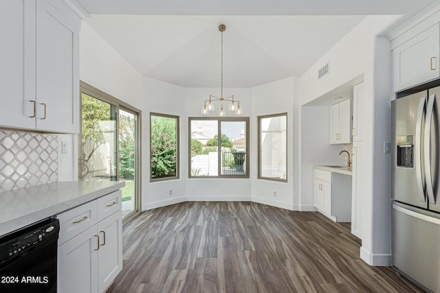 kitchen featuring white cabinetry, stainless steel fridge, dark hardwood / wood-style floors, and dishwasher