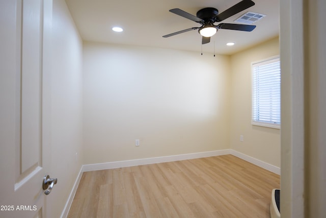 unfurnished room featuring ceiling fan and light hardwood / wood-style floors