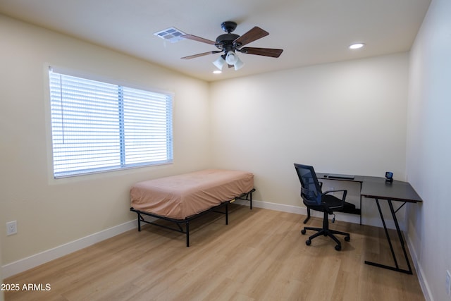 bedroom featuring light hardwood / wood-style floors and ceiling fan