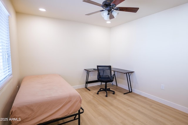 bedroom with ceiling fan and light wood-type flooring