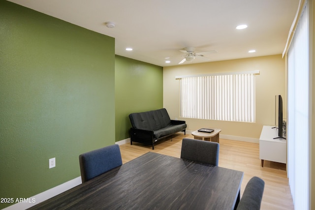 dining area featuring ceiling fan and light wood-type flooring