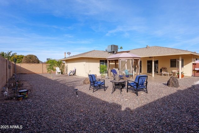 back of property featuring a gazebo, a patio, and cooling unit