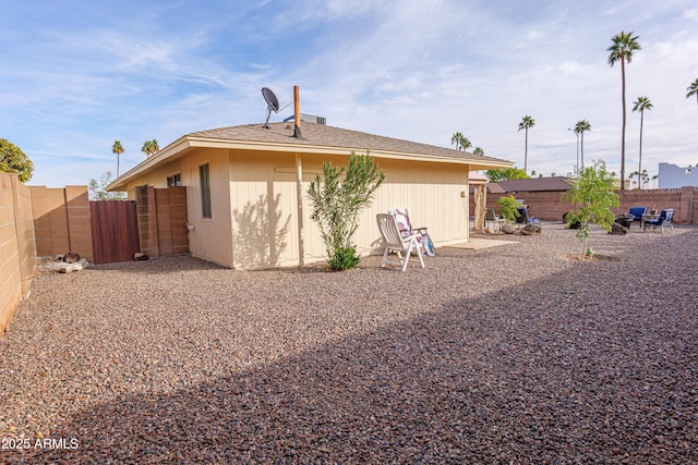 rear view of property featuring a patio area