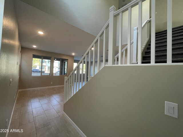 stairs with tile patterned flooring