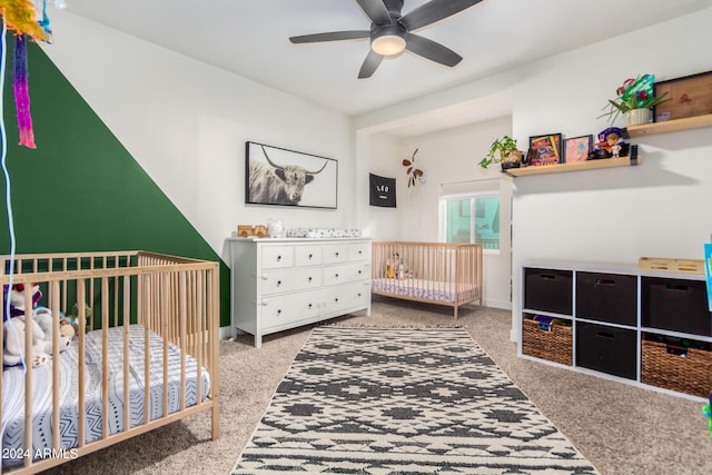 carpeted bedroom featuring a crib