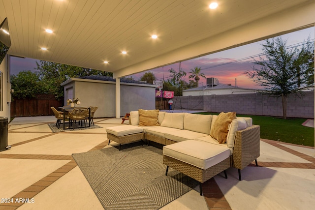 patio terrace at dusk with an outdoor hangout area