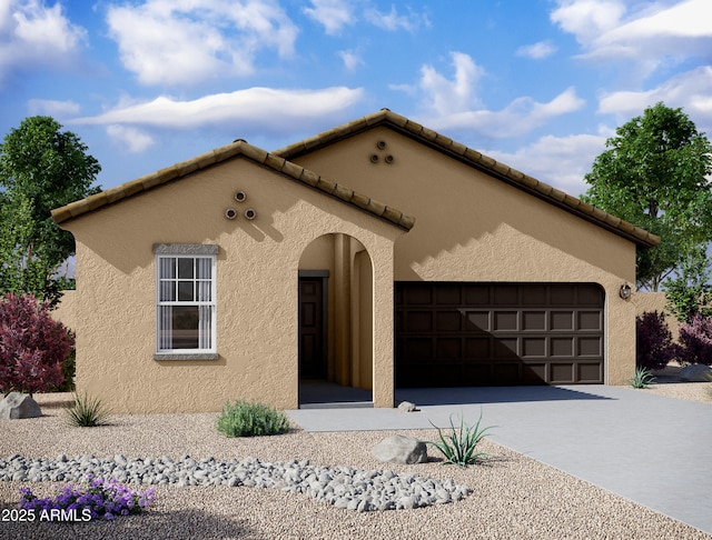 mediterranean / spanish house with an attached garage, a tile roof, concrete driveway, and stucco siding