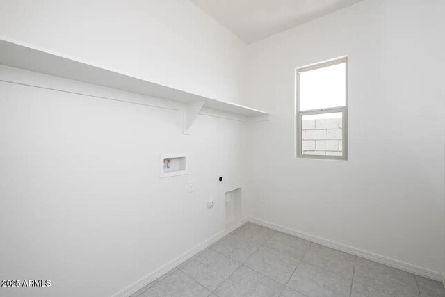 washroom with hookup for a gas dryer, laundry area, washer hookup, baseboards, and electric dryer hookup