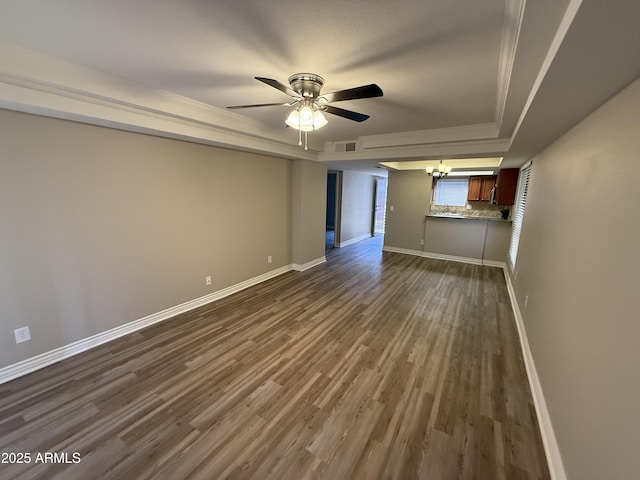 3434 W Danbury Dr Unit A206, Phoenix, AZ 85053 - unfurnished room featuring a tray ceiling, a ceiling fan, dark wood-type flooring, and a chandelier