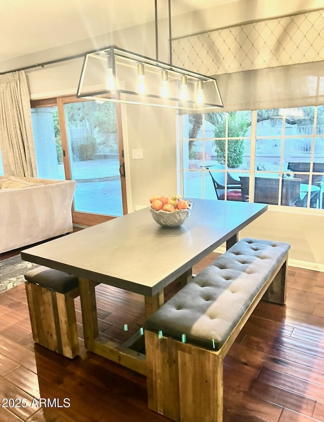 dining space featuring wood-type flooring