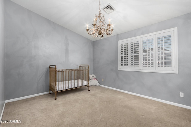 bedroom featuring visible vents, baseboards, an inviting chandelier, and carpet flooring