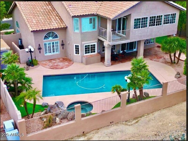 view of swimming pool featuring a patio area, a fenced backyard, and a fenced in pool