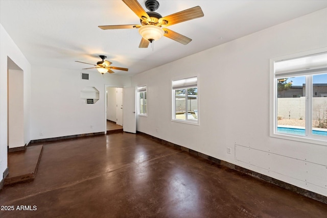 3814 E Poinsettia Dr, Phoenix, AZ 85028 - spare room featuring baseboards, finished concrete floors, and ceiling fan