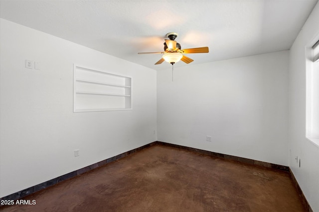3814 E Poinsettia Dr, Phoenix, AZ 85028 - empty room featuring ceiling fan, concrete floors, baseboards, and built in shelves