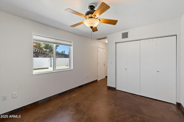 3814 E Poinsettia Dr, Phoenix, AZ 85028 - unfurnished bedroom with baseboards, finished concrete flooring, a closet, and ceiling fan