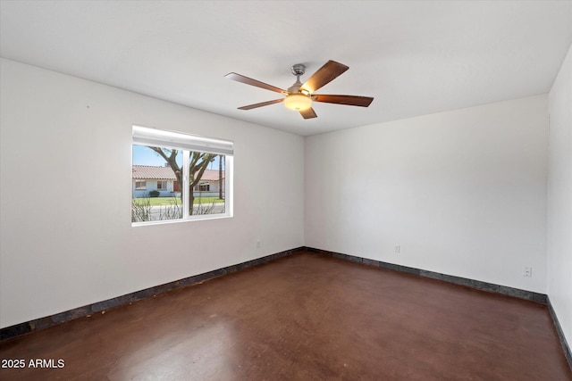 3814 E Poinsettia Dr, Phoenix, AZ 85028 - spare room with finished concrete floors, baseboards, and ceiling fan
