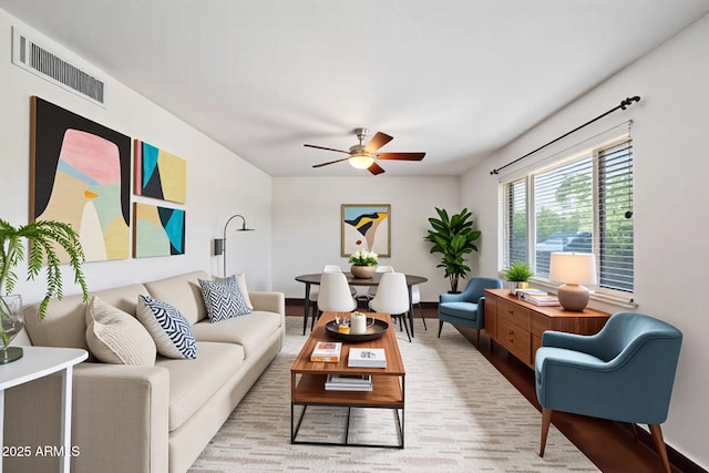 3814 E Poinsettia Dr, Phoenix, AZ 85028 - living area with a ceiling fan, baseboards, and wood finished floors