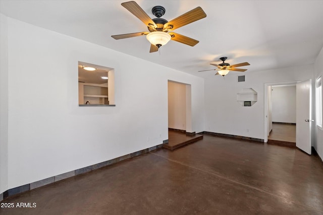 3814 E Poinsettia Dr, Phoenix, AZ 85028 - empty room featuring finished concrete flooring, baseboards, and ceiling fan