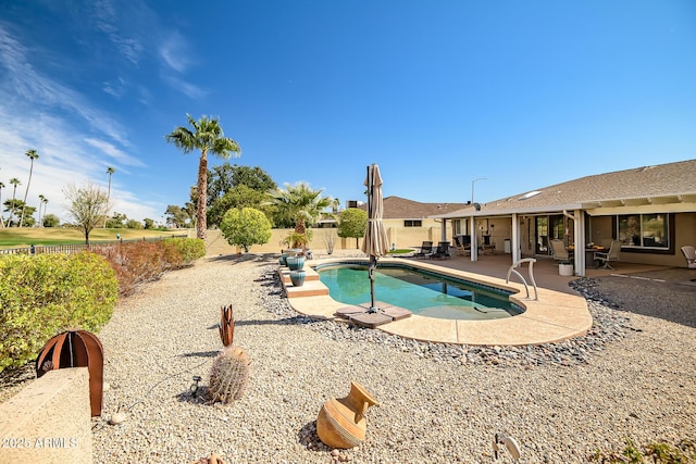 view of swimming pool featuring a fenced in pool, a patio area, and a fenced backyard