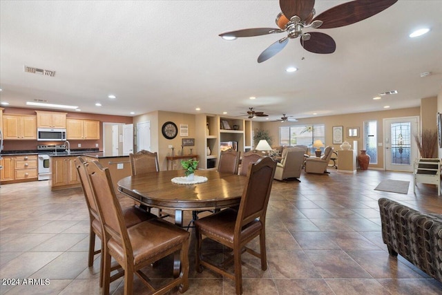 dining area featuring recessed lighting, visible vents, and dark tile patterned floors