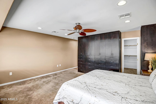 bedroom with baseboards, recessed lighting, visible vents, and light colored carpet