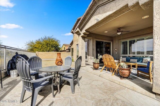 34014 N 43rd St, Cave Creek, AZ 85331 - fenced backyard featuring outdoor dining area, outdoor lounge area, a patio, and a ceiling fan