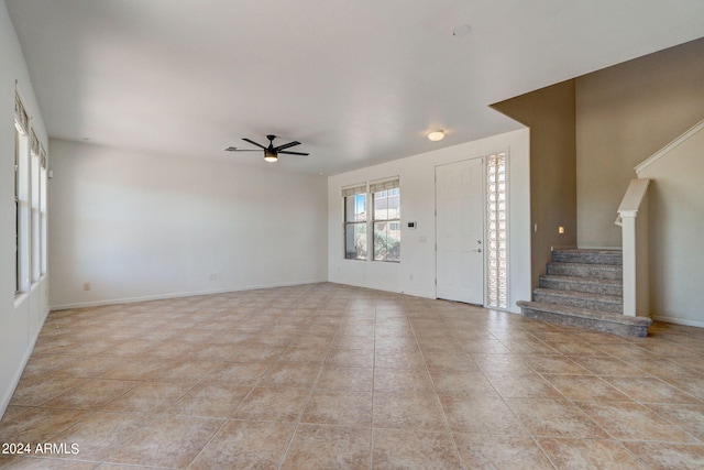 foyer entrance featuring ceiling fan and light tile patterned floors