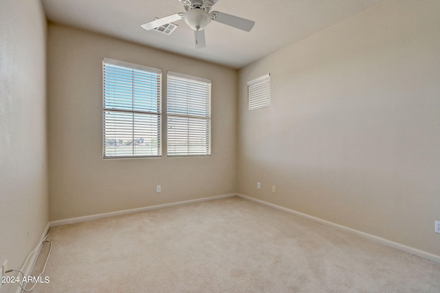 carpeted empty room with ceiling fan