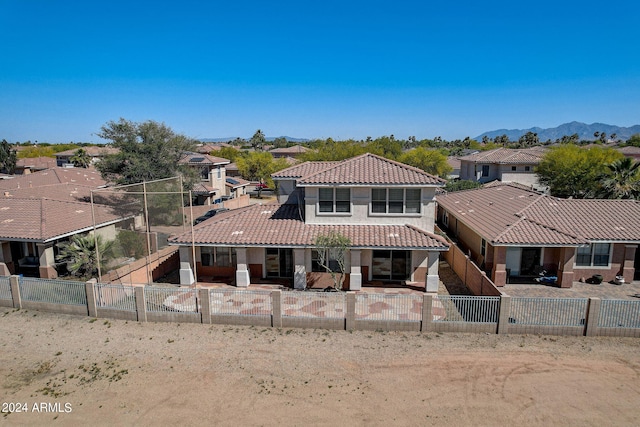 view of front of home featuring a mountain view and a patio area