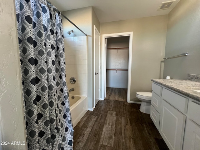 full bathroom with toilet, shower / tub combo with curtain, vanity, and hardwood / wood-style flooring