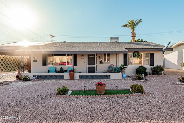 ranch-style house featuring a carport and a porch