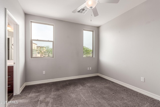 empty room featuring carpet and ceiling fan