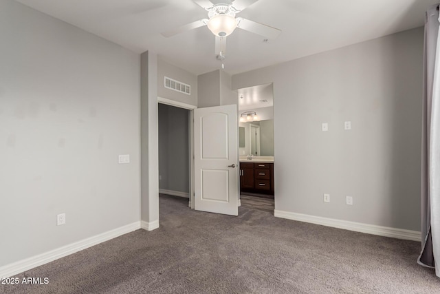 unfurnished bedroom featuring connected bathroom, ceiling fan, sink, and carpet floors