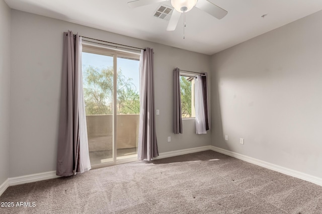 empty room with carpet and ceiling fan