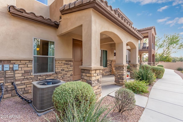 property entrance featuring cooling unit